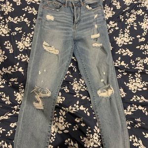 Light blue wash distressed jeans. Buckle. Size 28